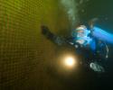 OFS's team marine biologist Holly Lohuis dives the Glacier Falls fish farm. © Carrie Vonderhaar, Ocean Futures Society/KQED Diving the Farm