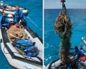 After the marine debris recovery team of expedition members Ed Cassano and Blair Mott returned to the boat with this 300-pound net, the Searcher crew lowered the crane to lift it out of the Zodiac in order to properly dispose of it. © Tom Ordway, Ocean Futures Society Marine Debris Recovery