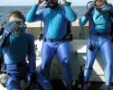 Expedition diver Holly Lohuis, Still Photographer Tom Ordway and Cinematographer Yves Lefevre get ready for a filming dive. © Nan Marr, Ocean Futures Society Dive Prep