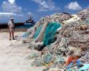 Jean-Michel Cousteau views the shocking sight of 82 tons of marine debris collected by NOAA's team at Pearl and Hermes Atoll in a brief two and a half week period. © Tom Ordway, Ocean Futures Society Two and a Half Weeks