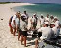 The Ocean Futures Society expedition team arrives on Laysan Island by zodiac, to meet and plan the day with USFWS and NMFS personnel stationed there. © Nan Marr, Ocean Futures Society Laysan Island