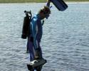 Jean-Michel Cousteau assigns Chief Diver Blair Mott with the task of diving in Laysan Lake, a hyper saline lake, to film brine shrimp. © Nan Marr, Ocean Futures Society Filming Brine Shrimp