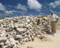 Jean-Michel Cousteau stands next to remnants of a guano pile left from the 1920's mining operations. © Tom Ordway, Ocean Futures Society Jean-Michel Cousteau