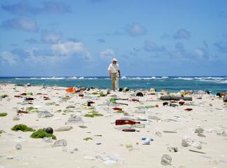 Jean-Michel Cousteau walks the littered beaches of the Northwestern Hawaiian Islands