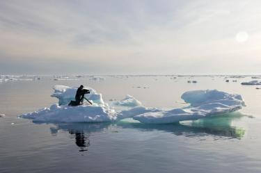 Director of Photography Matthew Ferraro films on the ice in the Canadian Arctic